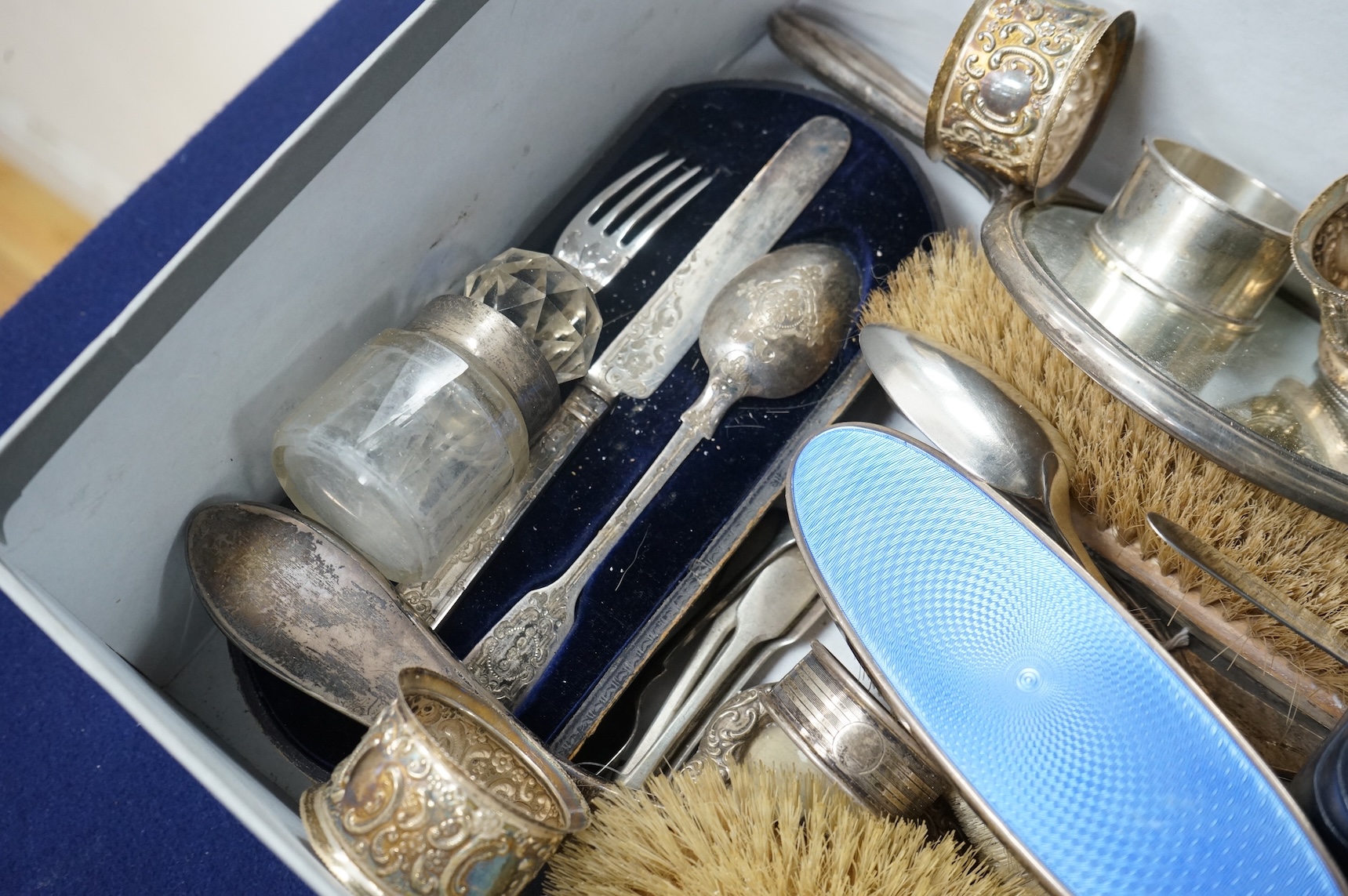 A quantity of assorted silver items including four silver and enamel clothes or hair brushes by Charles S. Green & Co Ltd, Birmingham, 1923, nine other mounted dressing table items, a Victorian christening trio, a set of